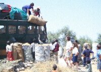 Loading sacks of charcoal